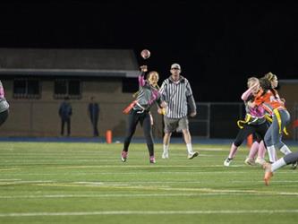 Powder Puff player throwing the ball