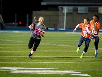 Powder Puff players running on the field